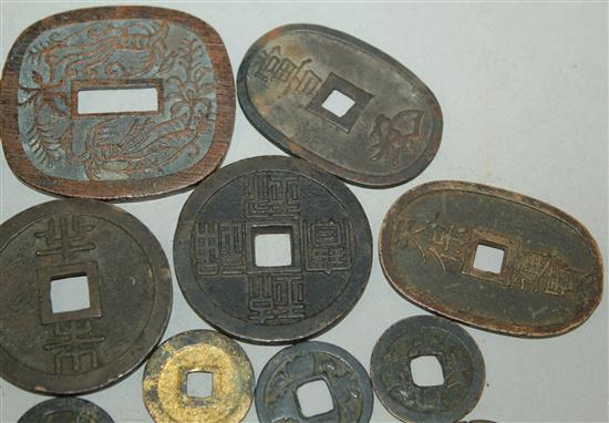 A collection of Japanese mon and half-shu coins and Chinese bronze and copper coins, 15th-19th century (23)